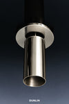 A close-up studio shot of a polished stainless steel cylindrical fixture or faucet component with a circular mounting plate, shown against a dark blue-to-black gradient background. The brand name 'DUNLIN' appears at the bottom.