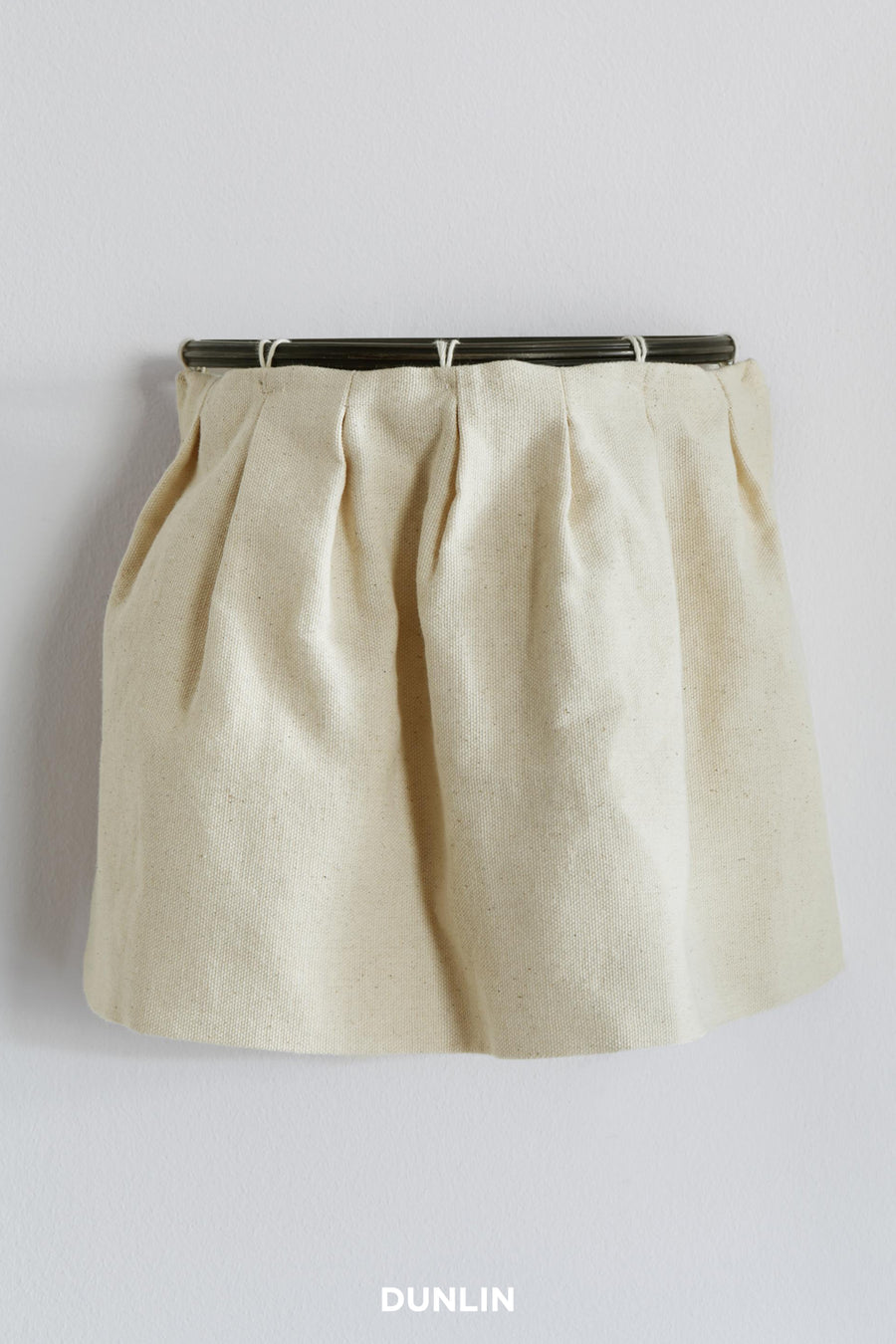 Skirt Wall Light by Rose Uniacke