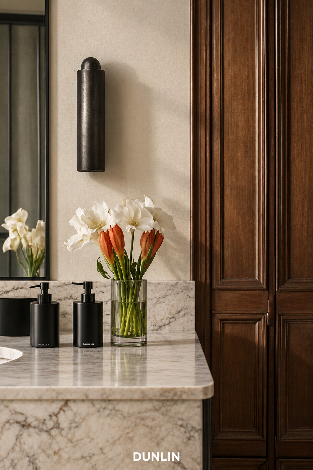 DUNLIN Decade Linear wall light in a warm marble and timber bathroom interior