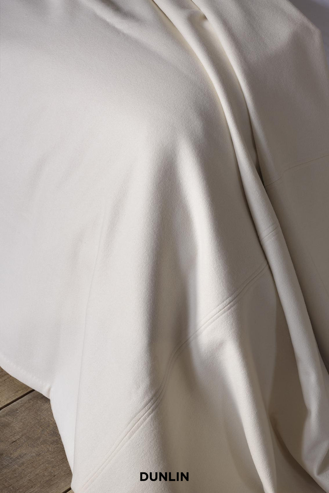 Rose Uniacke Bedspread in Pearl Wool at Dunlin