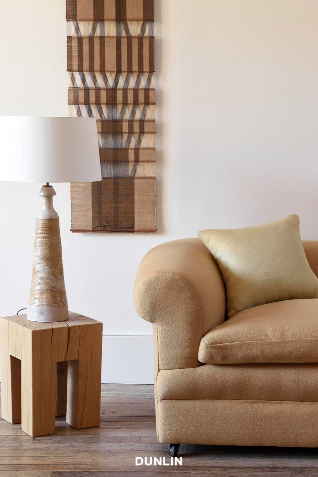 Carved Oak Side Table by Rose Uniacke at Dunlin with Antique sofa covered in Flapjack